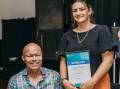 David Hall OAM presenting Claire Harvey with her award. Picture supplied