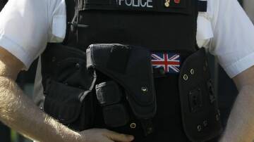 A UK police officer has been charged after he allegedly published an image in support of Hamas. (AP PHOTO)
