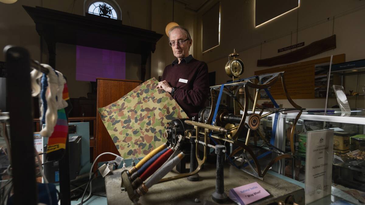 Morpeth Museum chairperson Alan Todd with an example of military fabric which was woven, dyed and flameproofed at Rutherford. Picture by Marina Neil
