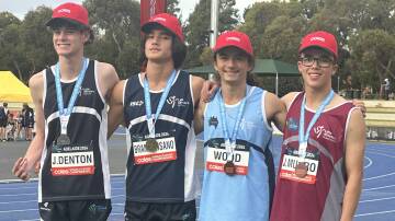 Maxwell Wood (second from right) receiving his bronze medal. Picture supplied