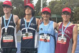 Maxwell Wood (second from right) receiving his bronze medal. Picture supplied