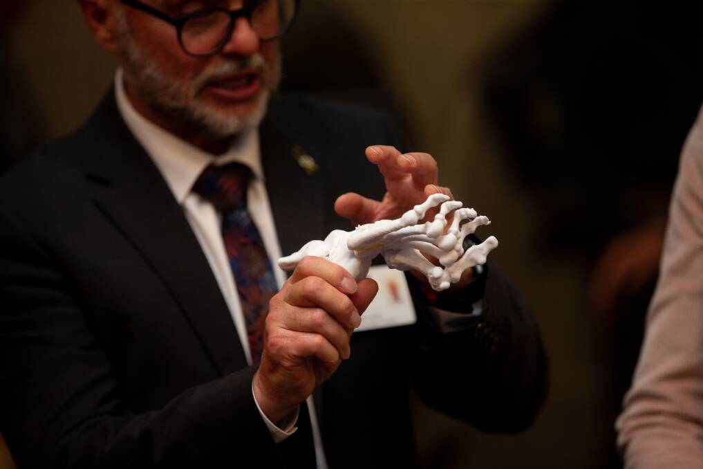 Professor Chris Levi with a 3D-printed foot at the lab launch. Picture by Jonathan Carroll 