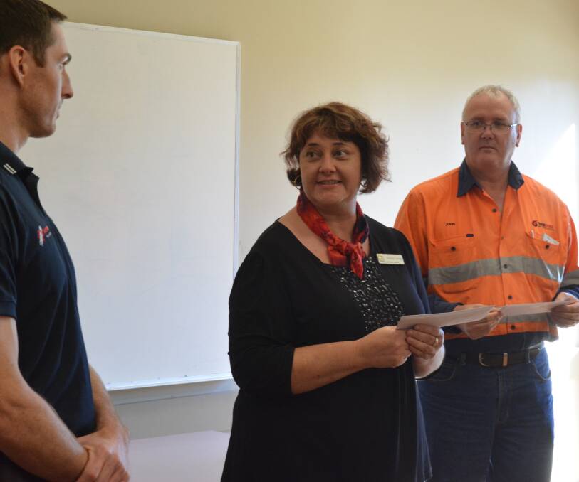 SUCCESSFUL: Simone Turner, centre, of Dungog Arts Society, accepts a grant from Stratford Coal's community support program. 