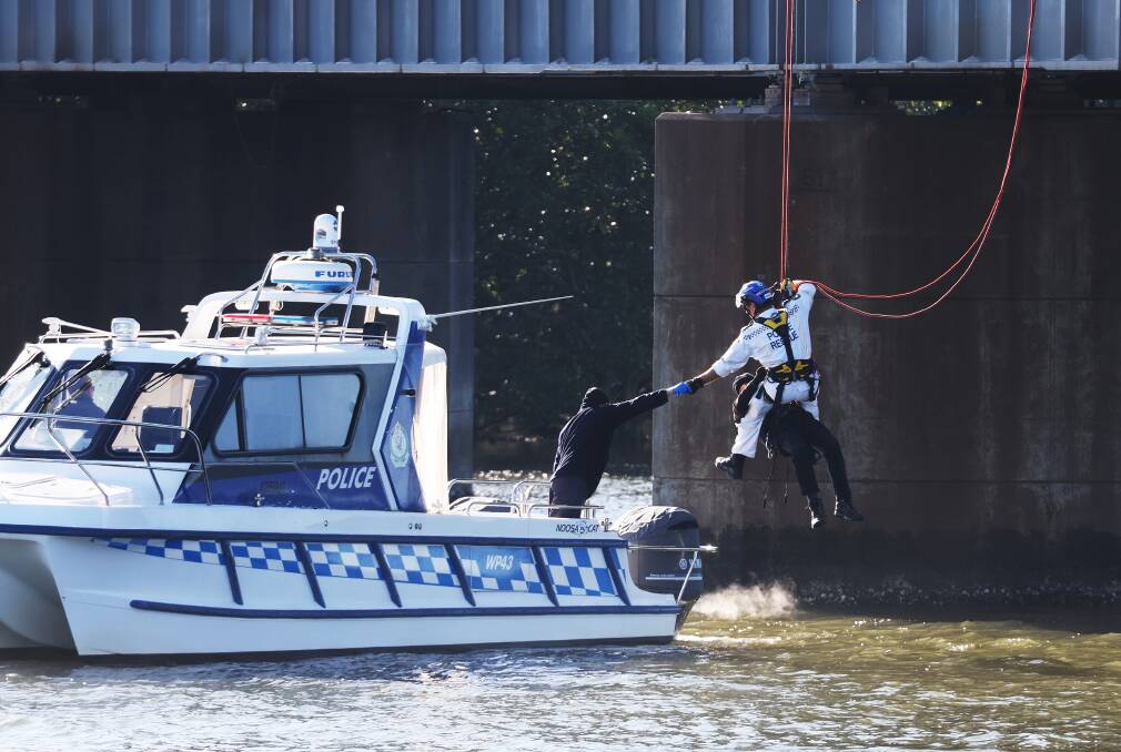 A protester is rescued at Kooragang on June 25. Picture by Peter Lorimer