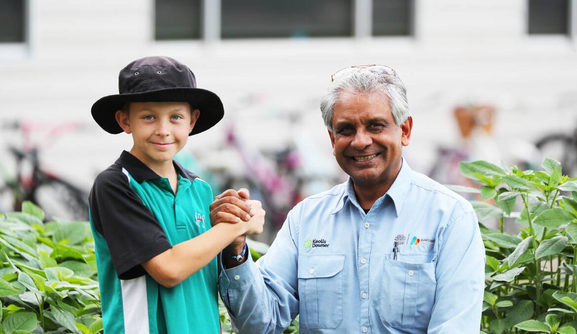 Year 6 Swansea Public School student Brock Keena has formed a new friendship with bus driver Sanjay Patel after doing a random act of kindness. Picture by Peter Lorimer