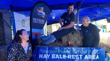 Paterson Public School P&C members Kate Meyn-Shrimpton, Darren Gill and Heidi Barker at the Tocal Field Days. The stall will be one of many at the agricultural campus over the next few days. Picture by Alanna Tomazin